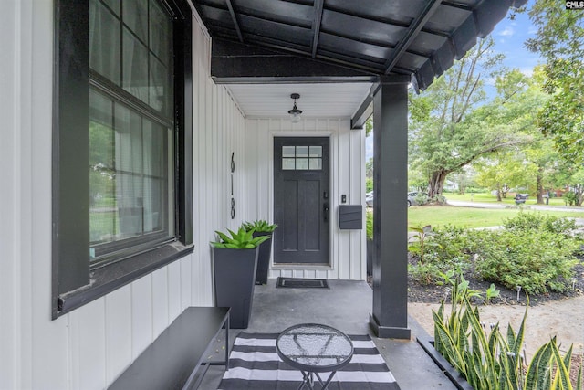 618 Joan St, Columbia, SC 29203 - property entrance featuring covered porch and board and batten siding