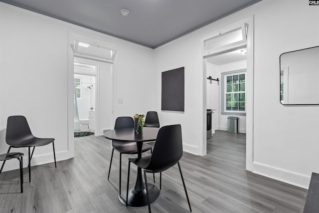 618 Joan St, Columbia, SC 29203 - dining room with wood finished floors, baseboards, and attic access
