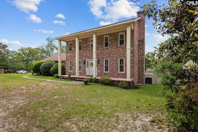 100 Dale Valley Rd, Columbia, SC 29223 - neoclassical home featuring a chimney, brick siding, a front lawn, and central AC unit