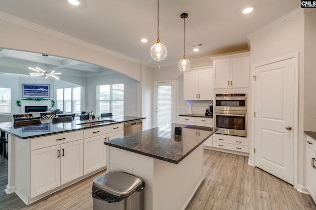 137 Brockway Dr, Columbia, SC 29229 - kitchen with a kitchen island, stainless steel appliances, a sink, light wood-style floors, and recessed lighting