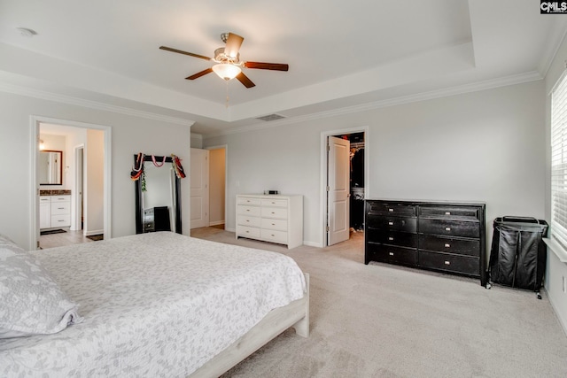 137 Brockway Dr, Columbia, SC 29229 - carpeted bedroom featuring a tray ceiling, crown molding, a walk in closet, a closet, and connected bathroom