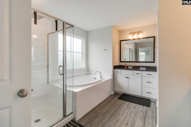 137 Brockway Dr, Columbia, SC 29229 - full bathroom with a bath, a shower stall, vanity, and wood finished floors