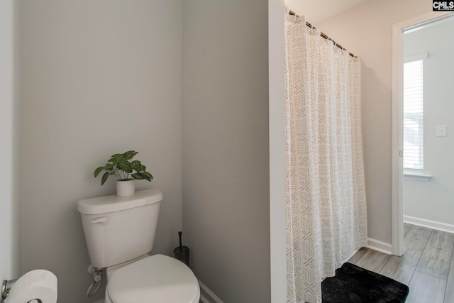 137 Brockway Dr, Columbia, SC 29229 - full bathroom featuring toilet, wood finished floors, a shower with curtain, and baseboards