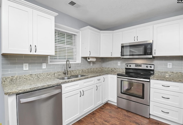 140 Otago Way W, Columbia, SC 29170 - kitchen featuring stainless steel appliances, a sink, white cabinets, and tasteful backsplash