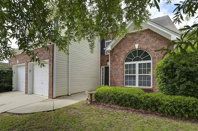 140 Otago Way W, Columbia, SC 29170 - view of side of home featuring brick siding, concrete driveway, and an attached garage