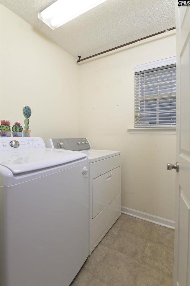 140 Otago Way W, Columbia, SC 29170 - washroom featuring independent washer and dryer, baseboards, a textured ceiling, and light tile patterned floors