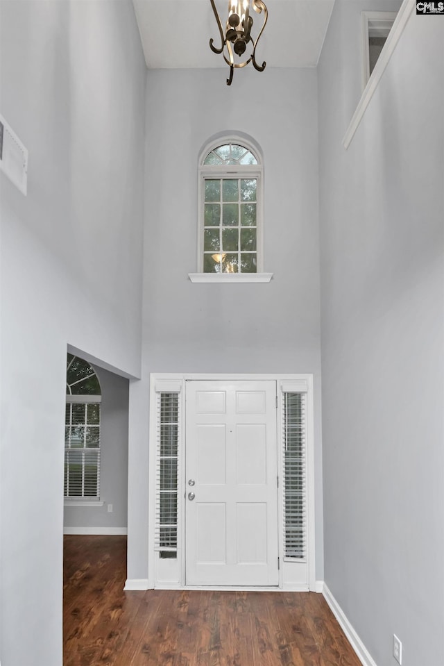 140 Otago Way W, Columbia, SC 29170 - foyer with a chandelier, a towering ceiling, baseboards, and wood finished floors