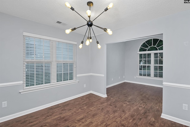 140 Otago Way W, Columbia, SC 29170 - spare room with a chandelier, wood finished floors, a textured ceiling, and baseboards