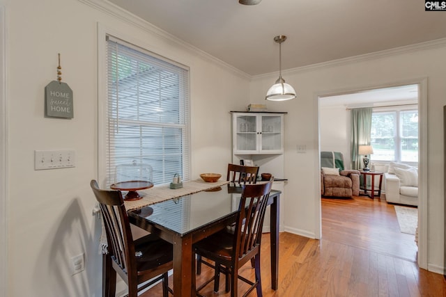2241 Atascadero Dr, Columbia, SC 29206 - dining area featuring ornamental molding, light wood-style floors, and baseboards