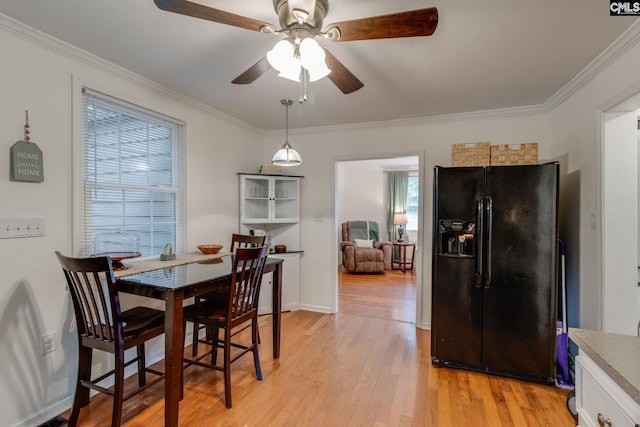 2241 Atascadero Dr, Columbia, SC 29206 - dining room with ceiling fan, light wood-style flooring, and ornamental molding