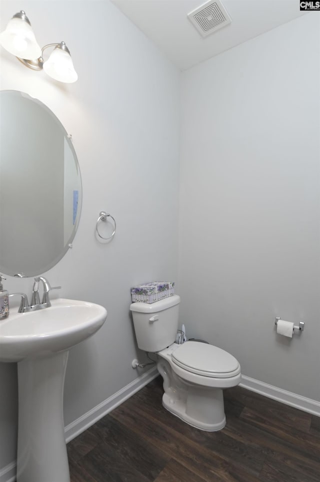 246 Harvest Glen Ln, West Columbia, SC 29169 - half bath with toilet, wood finished floors, baseboards, and a sink