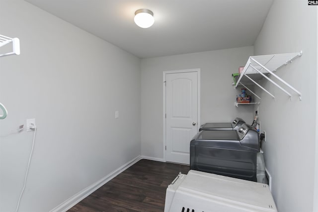 246 Harvest Glen Ln, West Columbia, SC 29169 - washroom featuring washing machine and clothes dryer, dark wood-type flooring, and baseboards