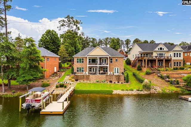 233 Pointe Overlook Dr, Chapin, SC 29036 - back of house featuring stairs, a lawn, a balcony, brick siding, and a deck with water view