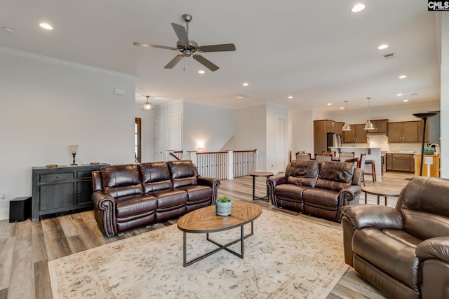 233 Pointe Overlook Dr, Chapin, SC 29036 - living room with light wood finished floors, a ceiling fan, ornamental molding, recessed lighting, and baseboards