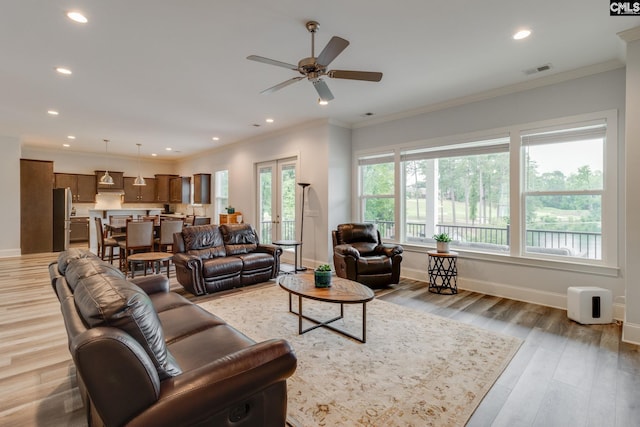 233 Pointe Overlook Dr, Chapin, SC 29036 - living area featuring baseboards, a ceiling fan, recessed lighting, light wood finished floors, and ornamental molding
