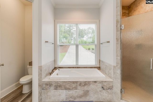 233 Pointe Overlook Dr, Chapin, SC 29036 - bathroom with toilet, a garden tub, a stall shower, crown molding, and wood finished floors