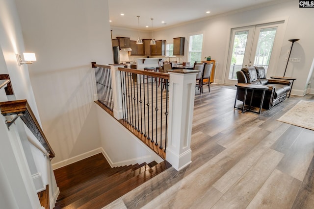 233 Pointe Overlook Dr, Chapin, SC 29036 - stairway featuring wood finished floors, baseboards, ornamental molding, french doors, and recessed lighting