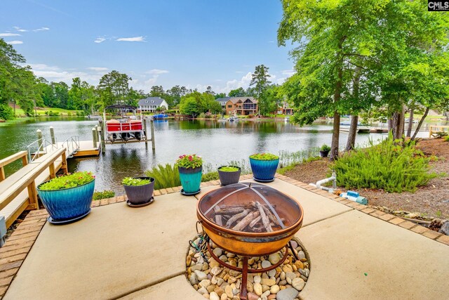 233 Pointe Overlook Dr, Chapin, SC 29036 - dock featuring a fire pit, boat lift, and a water view