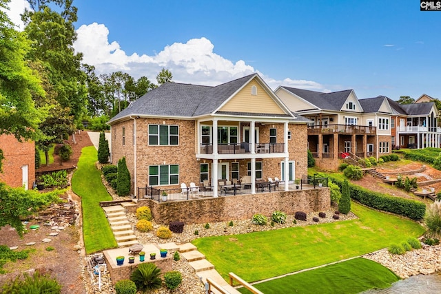 233 Pointe Overlook Dr, Chapin, SC 29036 - rear view of house with a balcony, stairway, a lawn, a patio area, and brick siding