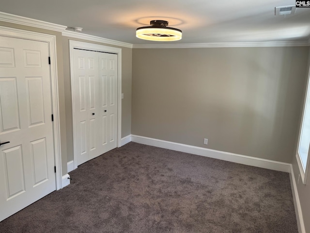 208 Juarez Ct, Columbia, SC 29206 - unfurnished bedroom with dark colored carpet, crown molding, a closet, and baseboards