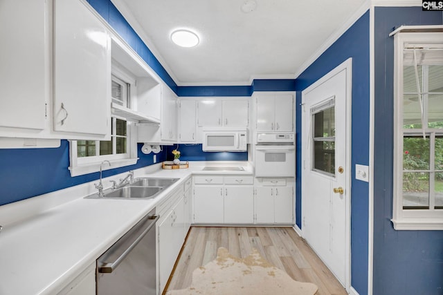 1818 Stratford Rd, Cayce, SC 29033 - kitchen featuring white appliances, a sink, light wood finished floors, white cabinetry, and light countertops