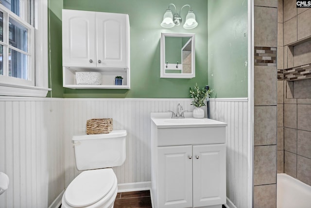 1818 Stratford Rd, Cayce, SC 29033 - bathroom featuring toilet, vanity, wainscoting, a tile shower, and baseboards