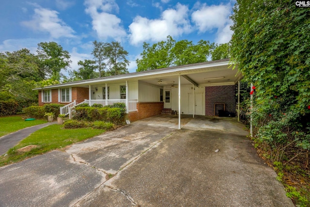 1818 Stratford Rd, Cayce, SC 29033 - ranch-style house featuring brick siding, driveway, a porch, a front lawn, and an attached carport