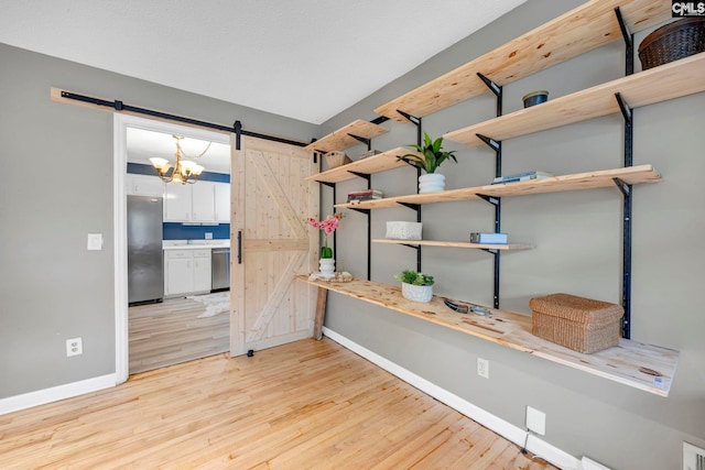 1818 Stratford Rd, Cayce, SC 29033 - unfurnished room with a barn door, baseboards, and light wood finished floors