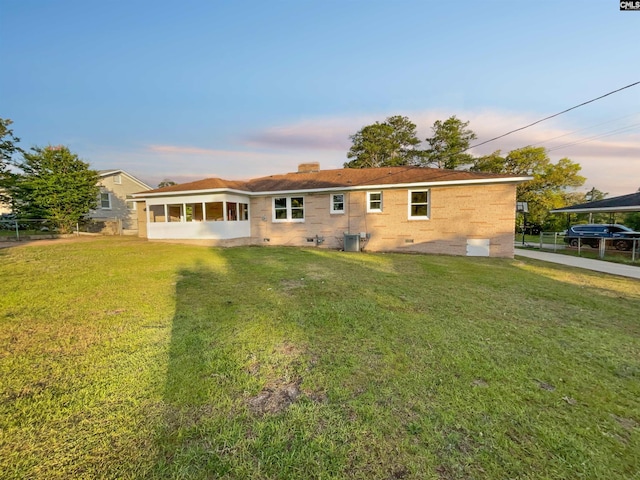 1920 Pennfield Dr, Columbia, SC 29223 - back of property with a chimney, a sunroom, and central AC