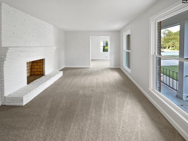 1920 Pennfield Dr, Columbia, SC 29223 - unfurnished living room featuring carpet, a fireplace, and baseboards