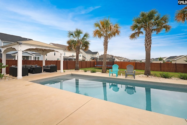 138 Long Cove Dr, Blythewood, SC 29016 - view of pool with an outdoor living space, a trampoline, a fenced backyard, a residential view, and a patio area