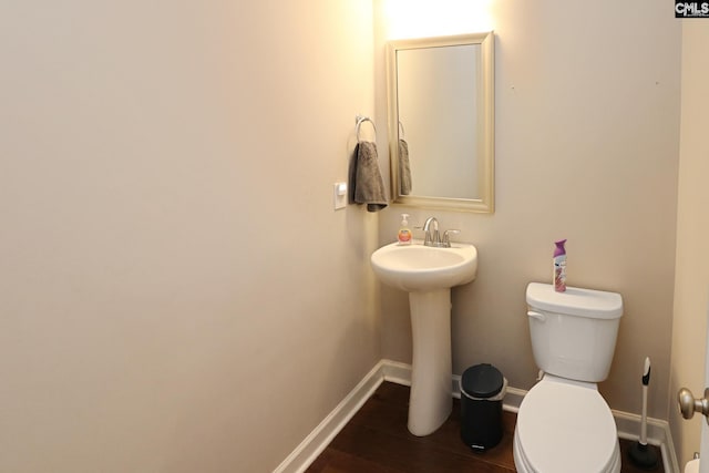 138 Long Cove Dr, Blythewood, SC 29016 - bathroom featuring toilet, baseboards, wood finished floors, and a sink