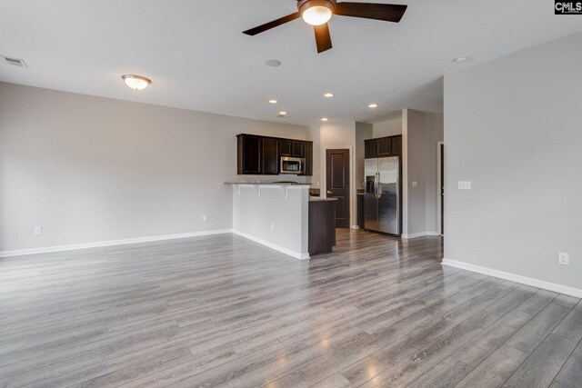 301 Chestnut Oak Ct, West Columbia, SC 29169 - unfurnished living room with ceiling fan, light wood-style floors, baseboards, and recessed lighting