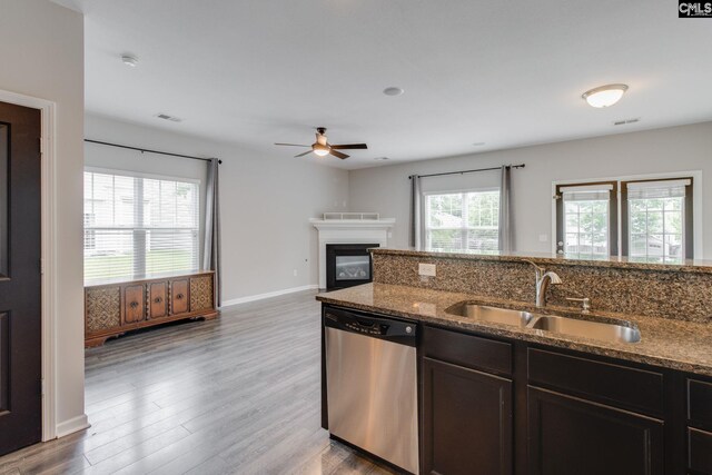 301 Chestnut Oak Ct, West Columbia, SC 29169 - kitchen with dishwasher, a sink, dark stone countertops, a ceiling fan, and wood finished floors
