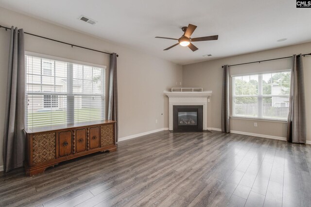 301 Chestnut Oak Ct, West Columbia, SC 29169 - unfurnished living room with a ceiling fan, wood finished floors, a fireplace with flush hearth, and baseboards