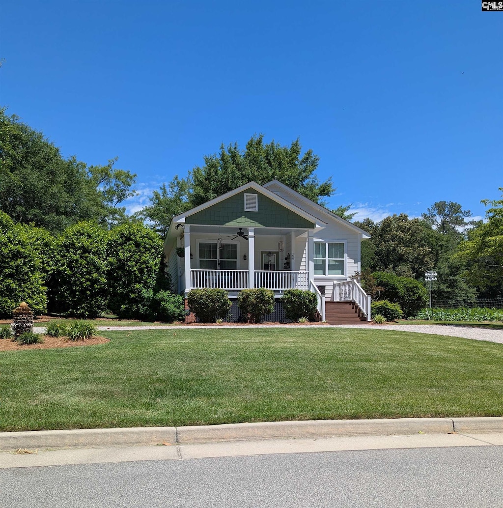 108 E Hampton, Camden, SC 29020 - view of front facade with covered porch, ceiling fan, and a front lawn