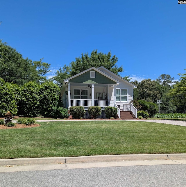 108 E Hampton, Camden, SC 29020 - view of front facade with covered porch, ceiling fan, and a front lawn