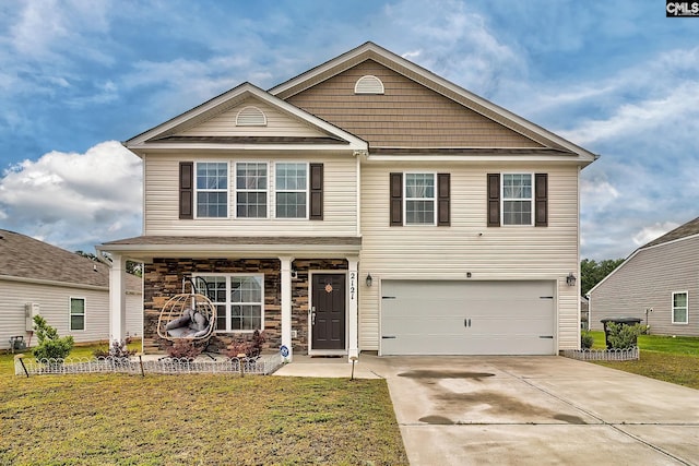 2121 Connor Way, Newberry, SC 29108 - view of front of home featuring driveway, an attached garage, a front yard, and covered porch