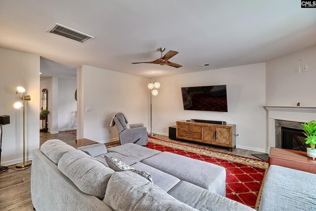 2121 Connor Way, Newberry, SC 29108 - living room with ceiling fan, a premium fireplace, baseboards, and wood finished floors