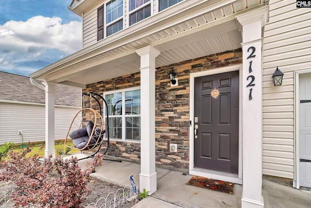2121 Connor Way, Newberry, SC 29108 - view of exterior entry featuring stone siding and a porch