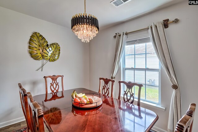 2121 Connor Way, Newberry, SC 29108 - dining room featuring a chandelier, healthy amount of natural light, baseboards, and wood finished floors