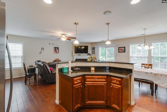 1123 Triple Crown Ct, Elgin, SC 29045 - kitchen with open floor plan, dark wood-type flooring, a ceiling fan, a chandelier, and recessed lighting