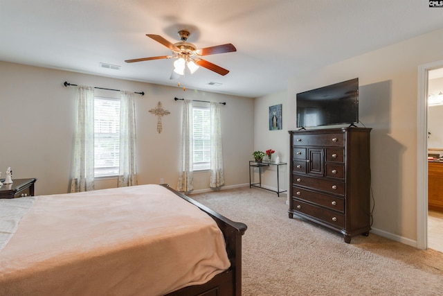 1123 Triple Crown Ct, Elgin, SC 29045 - bedroom featuring light colored carpet, baseboards, ensuite bath, and a ceiling fan