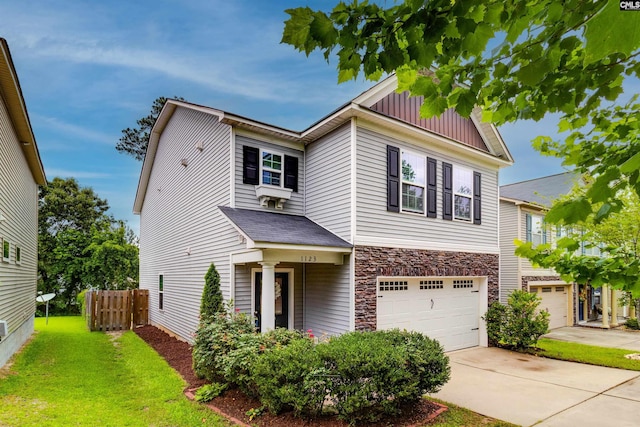 1123 Triple Crown Ct, Elgin, SC 29045 - view of front of property with a garage, stone siding, board and batten siding, and driveway