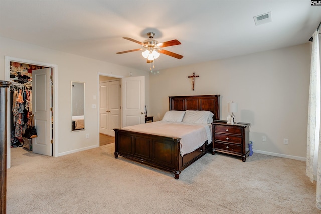 1123 Triple Crown Ct, Elgin, SC 29045 - bedroom with light colored carpet, a walk in closet, baseboards, and a closet
