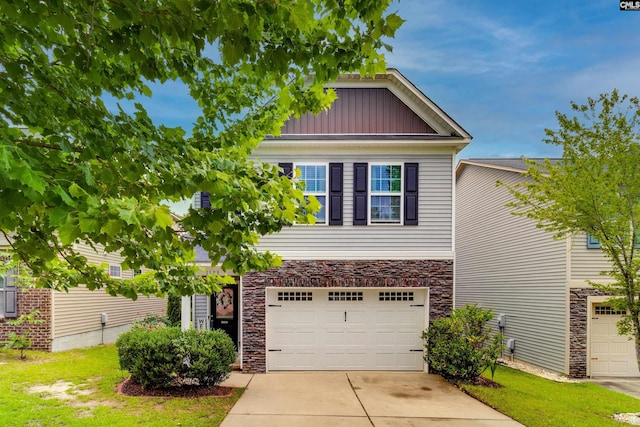 1123 Triple Crown Ct, Elgin, SC 29045 - view of front of home featuring stone siding, an attached garage, driveway, and board and batten siding