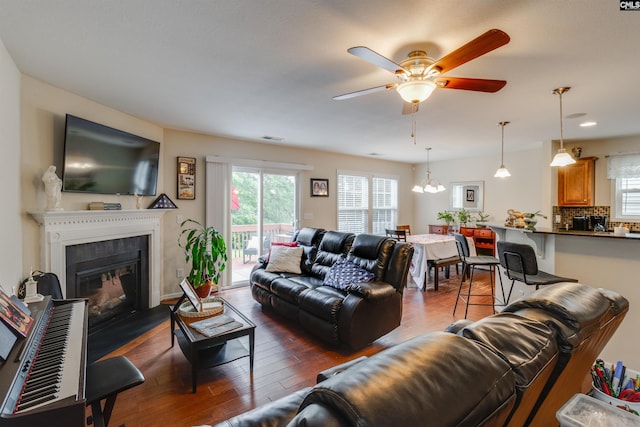 1123 Triple Crown Ct, Elgin, SC 29045 - living room with healthy amount of natural light, a ceiling fan, a fireplace with flush hearth, dark wood-style floors, and recessed lighting