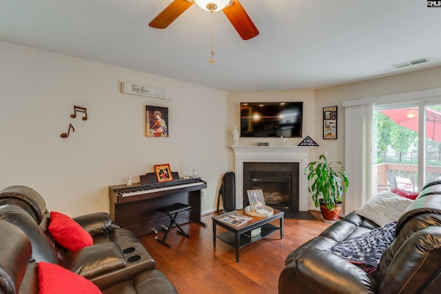 1123 Triple Crown Ct, Elgin, SC 29045 - living area with a ceiling fan, wood finished floors, and a fireplace with flush hearth