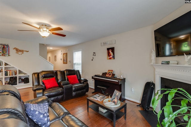 1123 Triple Crown Ct, Elgin, SC 29045 - living area with a ceiling fan, a fireplace with flush hearth, and wood finished floors