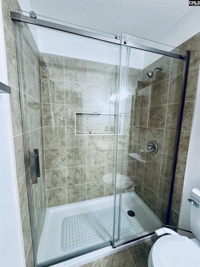 916 Sessions Rd, Elgin, SC 29045 - full bathroom with toilet, a stall shower, and a textured ceiling